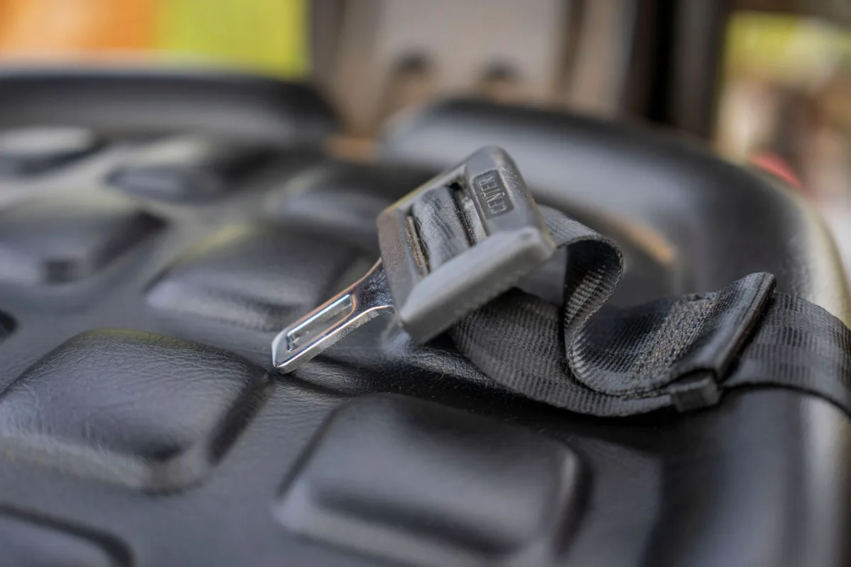 booster seat showing correct lap and shoulder belt position
