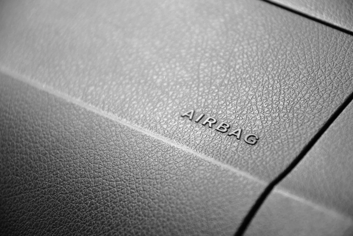 Child passenger safety certification label on a car seat shell